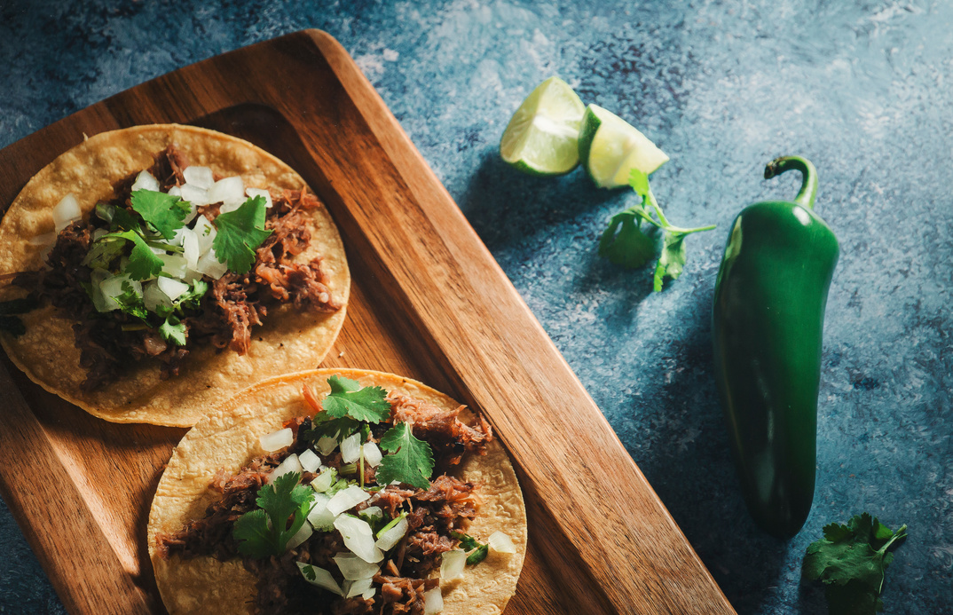 Tacos with Coriander on Wooden Board with Lime and Jalapeño